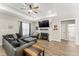 Comfortable living room features a fireplace, ceiling fan and large sectional at 52 Sagebrook Ct, Zebulon, NC 27597