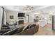 Open-concept living room boasts a fireplace and flows into a modern kitchen and dining area at 52 Sagebrook Ct, Zebulon, NC 27597