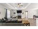 Comfortable living room features a fireplace and large sectional with a window at 52 Sagebrook Ct, Zebulon, NC 27597