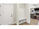 Entryway mud room with built in bench and cubbies with view into the living room at 52 Sagebrook Ct, Zebulon, NC 27597