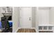 Office with built-in desk and shelves right next to the entry hallway mud room at 52 Sagebrook Ct, Zebulon, NC 27597