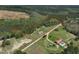 Aerial view of property showing homesite, outbuildings, and surrounding countryside at 660 Our Way, Linden, NC 28356