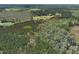 Aerial view showcasing the property's boundaries amid lush greenery at 660 Our Way, Linden, NC 28356