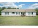 Charming ranch-style home with vinyl siding, black shutters, manicured lawn, and a welcoming front porch at 660 Our Way, Linden, NC 28356