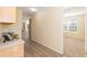 Hallway view showcases modern flooring and seamless transition to various rooms at 660 Our Way, Linden, NC 28356