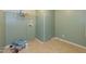 Laundry room with shelving, hookups and an adjacent room at 660 Our Way, Linden, NC 28356