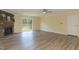 Living room showcasing a stone fireplace with a wooden mantle and sliding glass doors at 660 Our Way, Linden, NC 28356
