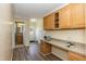 A well-lit office nook with built-in cabinets and a desk, perfect for working from home at 660 Our Way, Linden, NC 28356