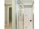 Clean shower area with glass door, complemented by the neutral color scheme at 660 Our Way, Linden, NC 28356