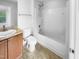 Bathroom featuring a vanity, toilet, and shower-tub combo at 7 Moonbeam Ct, Durham, NC 27712