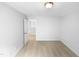 Bedroom leading to a hallway; the space has carpet and a neutral palette at 7 Moonbeam Ct, Durham, NC 27712