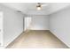 Large empty bedroom with neutral carpet and a glimpse into the attached bathroom at 7 Moonbeam Ct, Durham, NC 27712