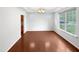Bright dining area features hardwood floors, natural light, and a view to the side yard at 7 Moonbeam Ct, Durham, NC 27712