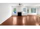 Open concept living room featuring a fireplace and hardwood floors at 7 Moonbeam Ct, Durham, NC 27712