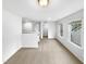 Upstairs loft area featuring carpeted floors and natural light from windows at 7 Moonbeam Ct, Durham, NC 27712