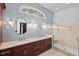 The bathroom includes double sinks, granite countertops, and a walk-in shower with a glass door at 7002 Old Trail Dr, Durham, NC 27712