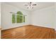 The bedroom has a large window that provides natural light and a view of the surrounding greenery at 7002 Old Trail Dr, Durham, NC 27712