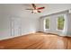 Inviting bedroom with hardwood floors, bright natural light and white walls and trim at 7002 Old Trail Dr, Durham, NC 27712