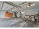 Three-car garage featuring overhead lighting and ample room for storage at 7002 Old Trail Dr, Durham, NC 27712