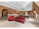 Spacious living room with plush seating area, billiard table, and warm color tones at 7002 Old Trail Dr, Durham, NC 27712