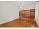 Spacious living room featuring hardwood floors, custom shelving, and recessed lighting at 7002 Old Trail Dr, Durham, NC 27712