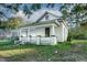 Charming home with inviting front porch and classic architectural details in a suburban landscape at 703 Cokey Rd, Rocky Mount, NC 27801