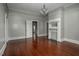Spacious living room showcasing hardwood floors, a decorative fireplace, and ample natural light at 703 Cokey Rd, Rocky Mount, NC 27801
