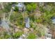 Aerial view of a home with a clearly marked property line surrounded by trees at 706 Kensington Dr, Chapel Hill, NC 27514