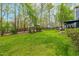 Lush green lawn is perfect for outdoor activities in the expansive backyard space at 706 Kensington Dr, Chapel Hill, NC 27514