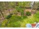 Expansive backyard with mature trees provides a serene outdoor space at 706 Kensington Dr, Chapel Hill, NC 27514