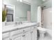 Bright bathroom featuring a marble countertop and white tile at 706 Kensington Dr, Chapel Hill, NC 27514