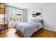 Comfortable bedroom with large windows and hardwood floors at 706 Kensington Dr, Chapel Hill, NC 27514