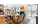 Bright living room featuring built-in bookshelves and a fireplace at 706 Kensington Dr, Chapel Hill, NC 27514