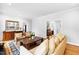 Comfortable living room with hardwood floors and access to the kitchen through a door at 706 Kensington Dr, Chapel Hill, NC 27514