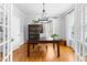 Bright and airy office space with hardwood floors, built-in shelving, and a large window at 706 Kensington Dr, Chapel Hill, NC 27514