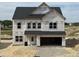 New two-story home featuring an attached two-car garage and unfinished yard at 709 Compeer Way # 32, Rolesville, NC 27571