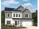 Charming two-story home featuring gray siding, a two-car garage, and a well-manicured lawn in a suburban setting at 709 Compeer Way # 32, Rolesville, NC 27571