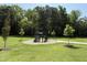 Community playground with swings, slides, and climbing structures for Gathering fun at 709 Compeer Way # 32, Rolesville, NC 27571
