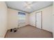 Bedroom with patterned wallpaper, a ceiling fan and carpeted floors at 711 Melanie St, Durham, NC 27704