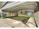 Spacious carport on a concrete slab, offering shelter for vehicles and outdoor equipment at 711 Melanie St, Durham, NC 27704