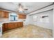 Bright kitchen with wood cabinets, appliances, and space for customization at 711 Melanie St, Durham, NC 27704