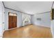 Bright living room featuring wood floors, neutral walls, and a front-facing window at 711 Melanie St, Durham, NC 27704