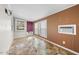 Sun room with large windows, paneled walls and tile floors at 711 Melanie St, Durham, NC 27704