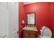 Stylish bathroom features a granite countertop vanity, a decorative mirror, and a toilet at 7336 Barham Hollow Dr, Wake Forest, NC 27587
