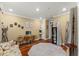 Bedroom featuring hardwood floors, vintage decor, and neutral color scheme at 7336 Barham Hollow Dr, Wake Forest, NC 27587