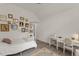 Spacious bedroom featuring a white four-poster bed, sewing desk, and gallery wall at 7336 Barham Hollow Dr, Wake Forest, NC 27587