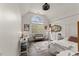 Light-filled bedroom with a large arched window, white furniture, and hardwood floors at 7336 Barham Hollow Dr, Wake Forest, NC 27587
