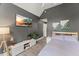A comfortable bedroom featuring a mounted TV and tasteful decor at 7336 Barham Hollow Dr, Wake Forest, NC 27587