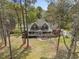 Beautiful two-story home with a welcoming front porch, nestled among mature trees at 7336 Barham Hollow Dr, Wake Forest, NC 27587