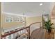 Foyer boasts an open design with hardwood floors and balcony overlooking the living room at 7336 Barham Hollow Dr, Wake Forest, NC 27587